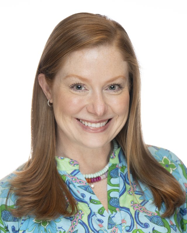 Corporate headshot on a white backdrop, shot at a Fate Media Creative booth