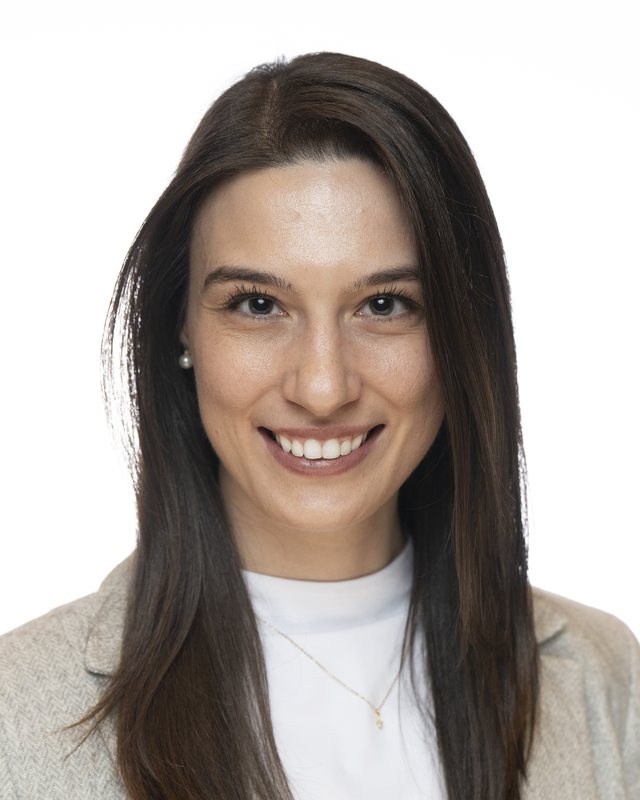 Corporate headshot on a white backdrop, shot at a Fate Media Creative booth
