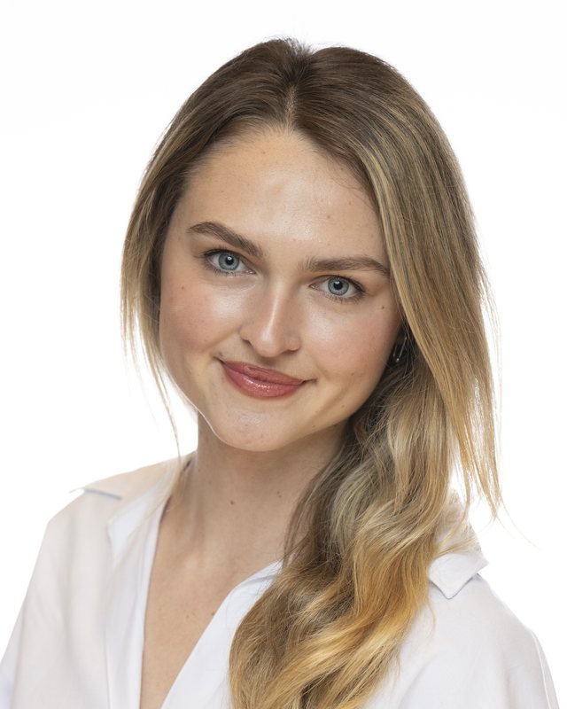 Corporate headshot on a white backdrop, shot at a Fate Media Creative booth
